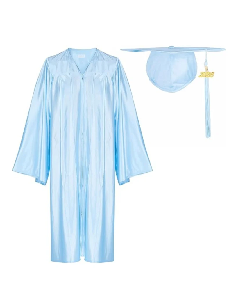 Female graduate wearing light blue graduation gown walking at graduation ceremony